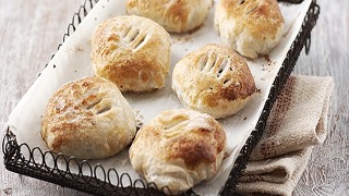 Clementine and Cranberry Eccles Cakes served on a wire rack