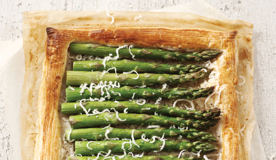 Asparagus Tart with Black Olive Dressing served on baking parchment